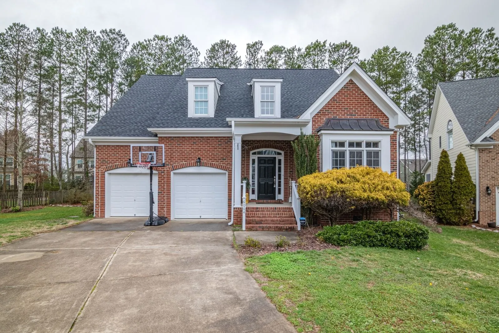 Brick home with a residential shingle roof